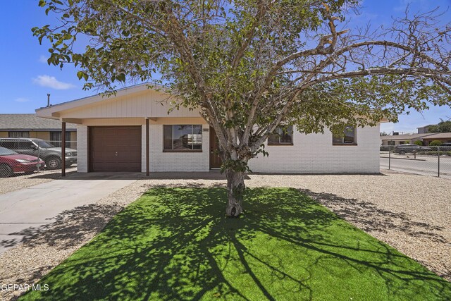 9606 Bahamas St, El Paso, TX 79927 - ranch-style house featuring brick siding, a garage, and driveway