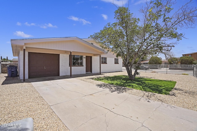 9606 Bahamas St, El Paso, TX 79927 - view of front of property with brick siding, driveway, and an attached garage