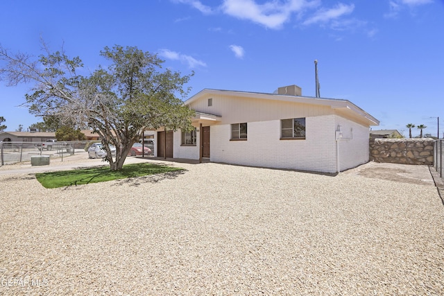 9606 Bahamas St, El Paso, TX 79927 - view of front of house featuring brick siding and gravel driveway