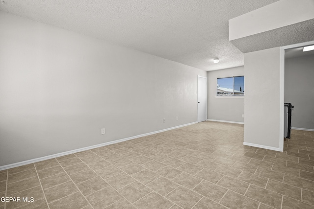 9606 Bahamas St, El Paso, TX 79927 - below grade area featuring a textured ceiling and baseboards