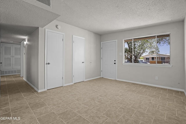 9606 Bahamas St, El Paso, TX 79927 - entrance foyer featuring a textured ceiling and baseboards