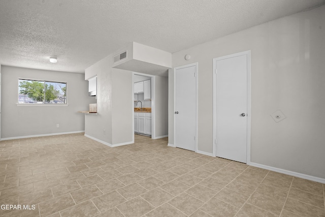 9606 Bahamas St, El Paso, TX 79927 - unfurnished room with a textured ceiling and a sink