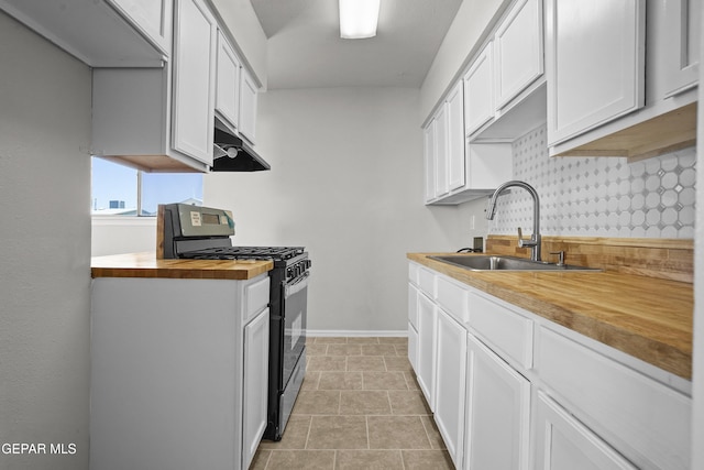 9606 Bahamas St, El Paso, TX 79927 - kitchen with range with gas stovetop, wooden counters, under cabinet range hood, and white cabinets