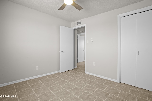 9606 Bahamas St, El Paso, TX 79927 - unfurnished bedroom with a textured ceiling, ceiling fan, a closet, and light tile patterned floors