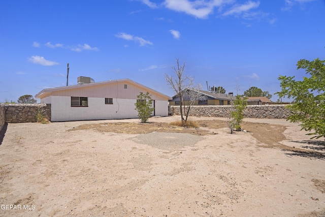 9606 Bahamas St, El Paso, TX 79927 - rear view of property with a fenced backyard and brick siding