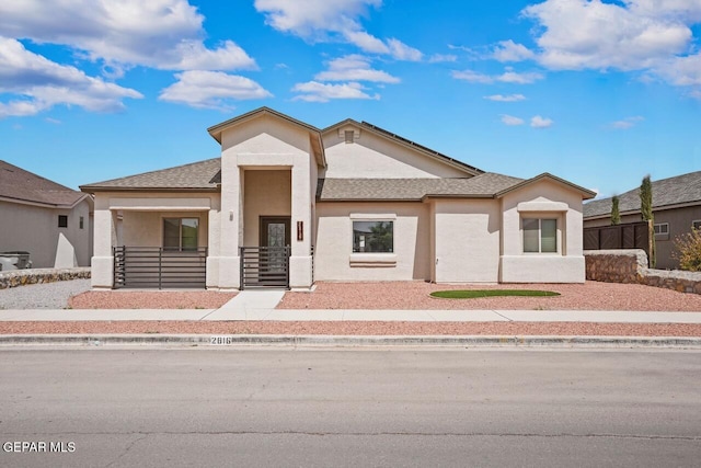 2816 Mike Price Dr, El Paso, TX 79938 - view of front facade featuring stucco siding and roof with shingles