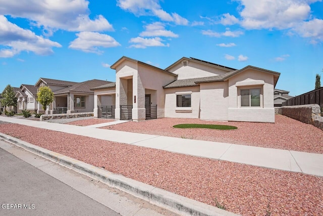 2816 Mike Price Dr, El Paso, TX 79938 - view of front of house with a garage, stucco siding, and concrete driveway