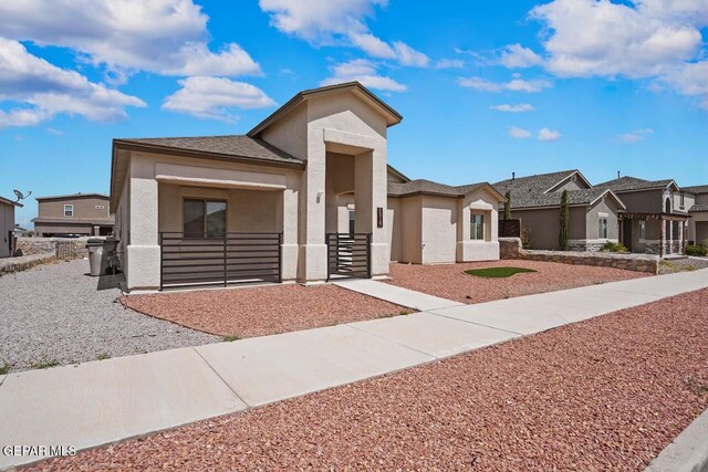 2816 Mike Price Dr, El Paso, TX 79938 - view of front of house with stucco siding and a residential view