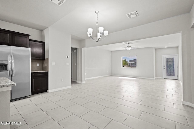 2816 Mike Price Dr, El Paso, TX 79938 - kitchen featuring stainless steel refrigerator with ice dispenser, a chandelier, decorative backsplash, ceiling fan, and open floor plan