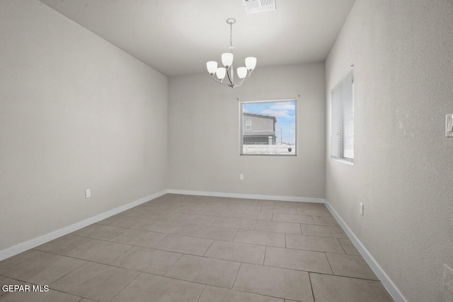 2816 Mike Price Dr, El Paso, TX 79938 - unfurnished room with a chandelier and light tile patterned floors