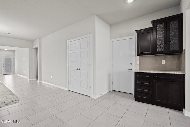 2816 Mike Price Dr, El Paso, TX 79938 - kitchen with light countertops, decorative backsplash, light tile patterned floors, and recessed lighting