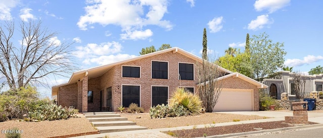 6735 Camino Fuente Dr, El Paso, TX 79912 - view of front of property with brick siding, driveway, and an attached garage