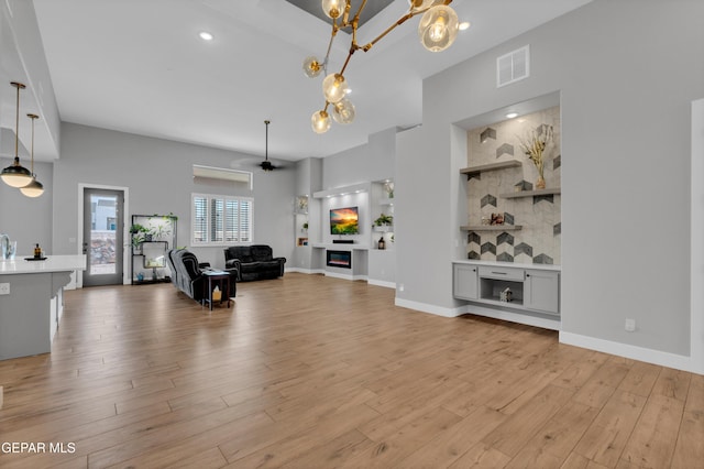 14405 Tierra Campeon, El Paso, TX 79938 - living area with light wood-style flooring, ceiling fan, a chandelier, recessed lighting, and baseboards