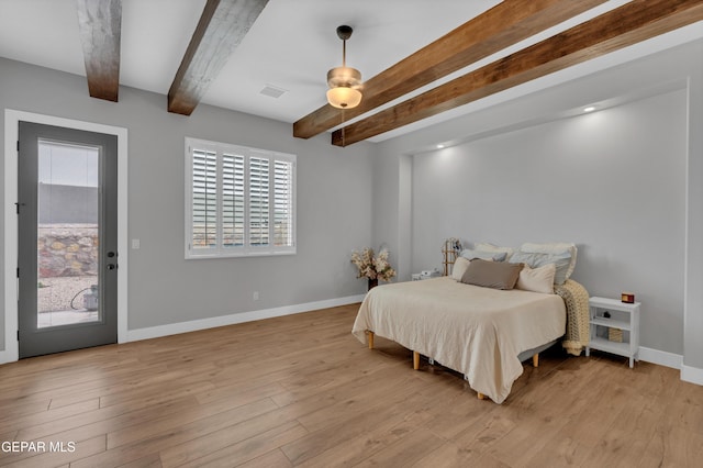 14405 Tierra Campeon, El Paso, TX 79938 - bedroom featuring beam ceiling, access to outside, baseboards, and light wood-style floors