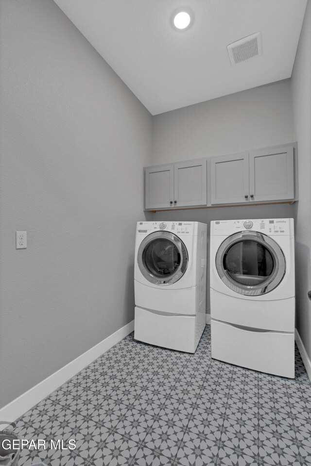 14405 Tierra Campeon, El Paso, TX 79938 - washroom featuring cabinet space, separate washer and dryer, baseboards, and light floors