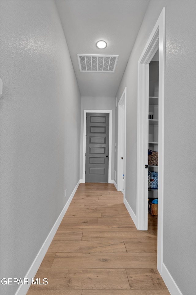 14405 Tierra Campeon, El Paso, TX 79938 - hallway featuring light wood-style floors and baseboards