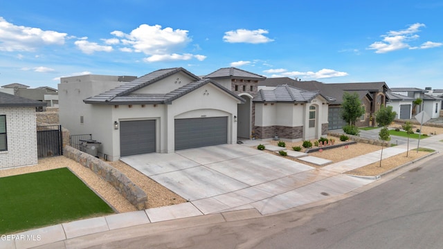 14405 Tierra Campeon, El Paso, TX 79938 - view of front of home with an attached garage, stucco siding, concrete driveway, a residential view, and a gate