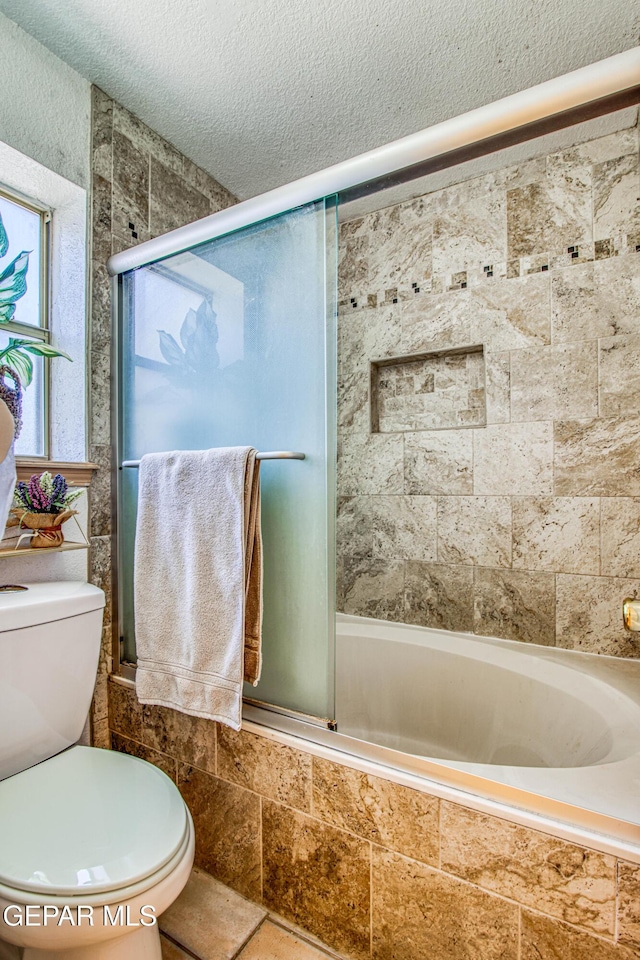 1809 Garden Gate Way, El Paso, TX 79936 - full bath featuring a textured ceiling and tiled shower / bath combo