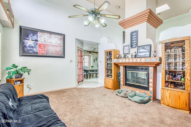 1809 Garden Gate Way, El Paso, TX 79936 - living room featuring a ceiling fan, carpet flooring, and a tiled fireplace