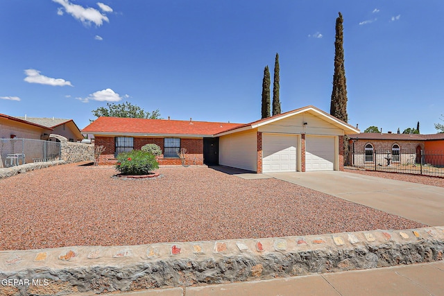 10749 Rushing Rd, El Paso, TX 79924 - ranch-style house with a garage, brick siding, and concrete driveway