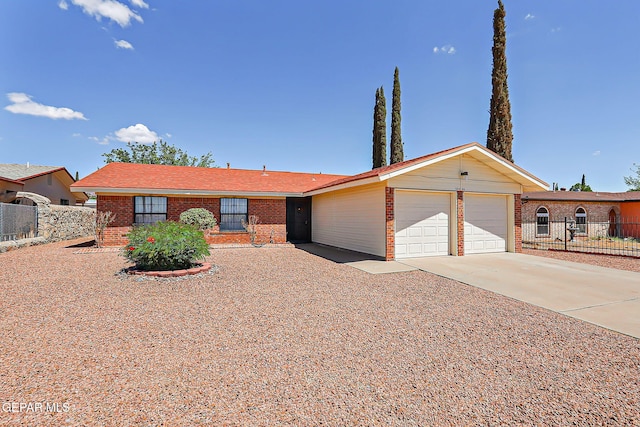 10749 Rushing Rd, El Paso, TX 79924 - single story home featuring brick siding, an attached garage, and concrete driveway