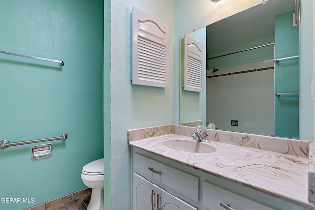 10749 Rushing Rd, El Paso, TX 79924 - bathroom with vanity, toilet, wood finished floors, and a shower