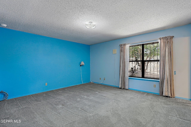 10749 Rushing Rd, El Paso, TX 79924 - carpeted empty room featuring a textured ceiling and baseboards