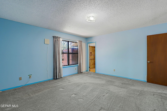 10749 Rushing Rd, El Paso, TX 79924 - unfurnished room featuring carpet floors, a textured ceiling, and baseboards