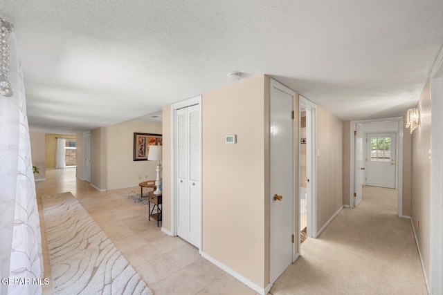 8820 Dirk Ct, El Paso, TX 79925 - corridor featuring a textured ceiling