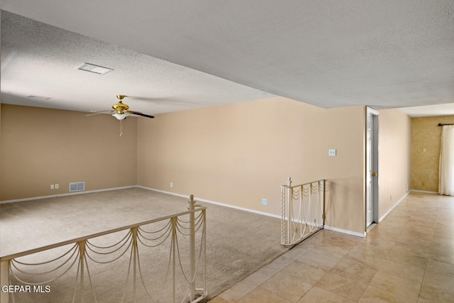 8820 Dirk Ct, El Paso, TX 79925 - carpeted empty room with ceiling fan and a textured ceiling