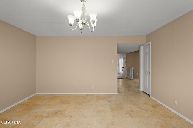 8820 Dirk Ct, El Paso, TX 79925 - spare room with a chandelier and baseboards