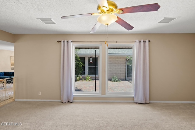 8820 Dirk Ct, El Paso, TX 79925 - empty room featuring carpet, a ceiling fan, and a textured ceiling