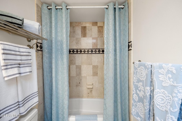 8820 Dirk Ct, El Paso, TX 79925 - bathroom featuring shower / tub combo with curtain and toilet