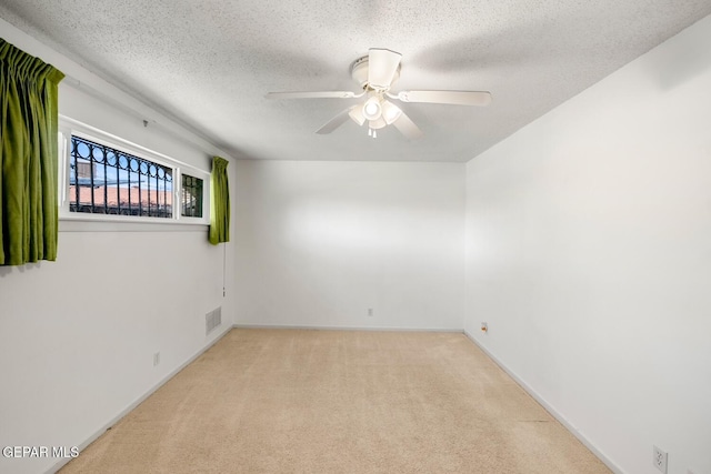 8820 Dirk Ct, El Paso, TX 79925 - carpeted empty room featuring a textured ceiling and ceiling fan