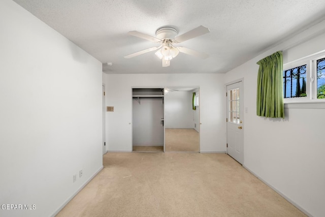 8820 Dirk Ct, El Paso, TX 79925 - unfurnished bedroom with carpet, a closet, a textured ceiling, and ceiling fan