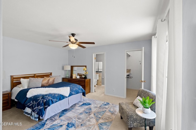 8820 Dirk Ct, El Paso, TX 79925 - bedroom featuring carpet, a spacious closet, ceiling fan, and connected bathroom