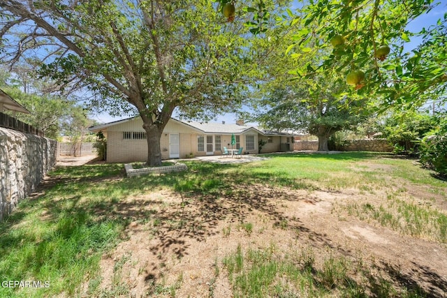 8820 Dirk Ct, El Paso, TX 79925 - fenced backyard with a patio