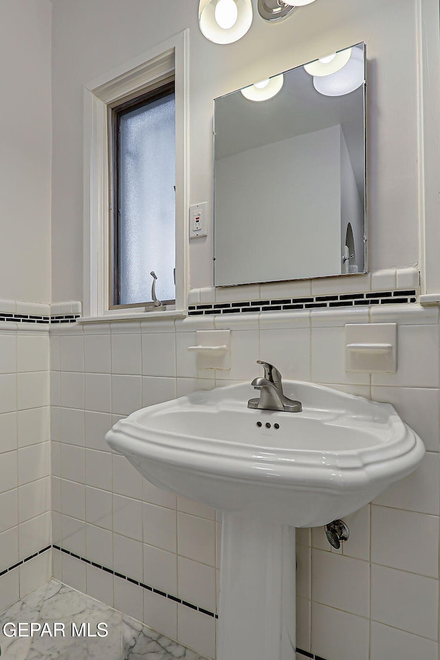 818 Kerbey Ave, El Paso, TX 79902 - bathroom featuring tile walls and a sink