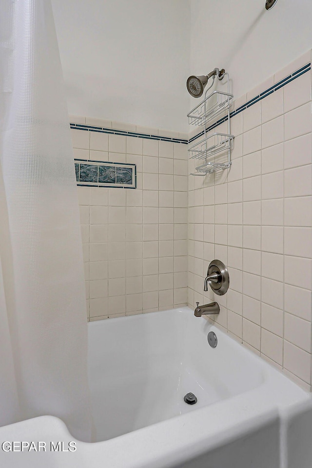 818 Kerbey Ave, El Paso, TX 79902 - bathroom with shower / bathtub combination with curtain and toilet