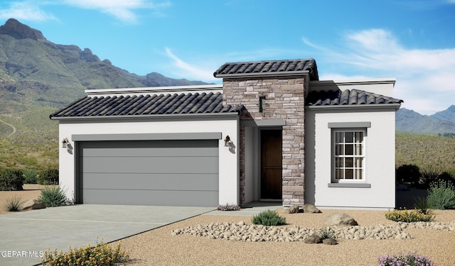 916 Pettus Pl, El Paso, TX 79928 - view of front of home with a tiled roof, a mountain view, stucco siding, an attached garage, and driveway