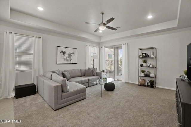 916 Pettus Pl, El Paso, TX 79928 - carpeted living room featuring a raised ceiling, ceiling fan, recessed lighting, and baseboards
