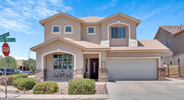 2201 Morning Mist Pl, El Paso, TX 79938 - view of front of property with a porch, stone siding, driveway, and stucco siding