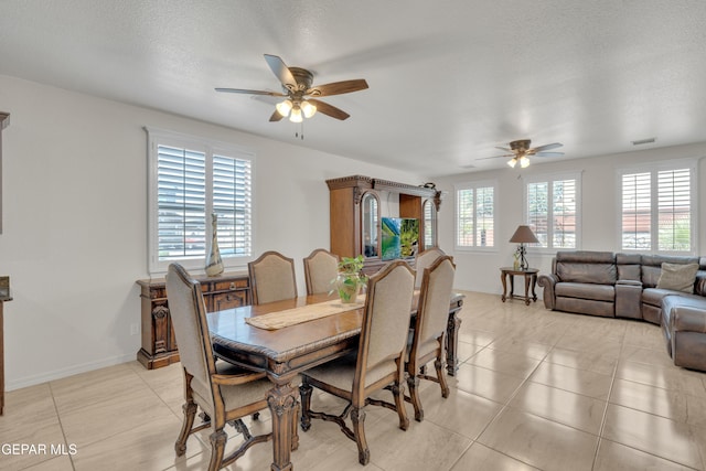 2201 Morning Mist Pl, El Paso, TX 79938 - dining area featuring ceiling fan, light tile patterned floors, and baseboards