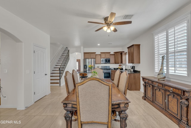 2201 Morning Mist Pl, El Paso, TX 79938 - dining area with a ceiling fan, stairway, baseboards, and light tile patterned flooring