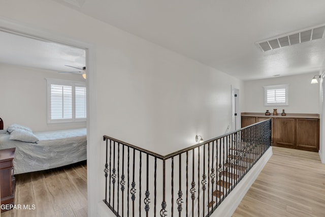 2201 Morning Mist Pl, El Paso, TX 79938 - hallway with an upstairs landing and light wood-style flooring