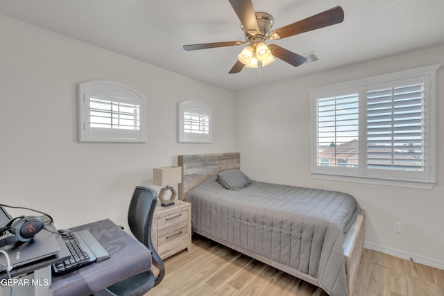 2201 Morning Mist Pl, El Paso, TX 79938 - bedroom featuring light wood-style flooring, a desk, baseboards, and ceiling fan