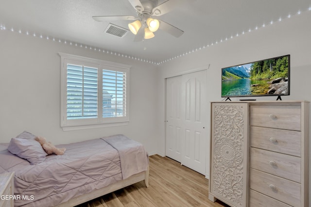 2201 Morning Mist Pl, El Paso, TX 79938 - bedroom with light wood-style floors, a closet, and baseboards