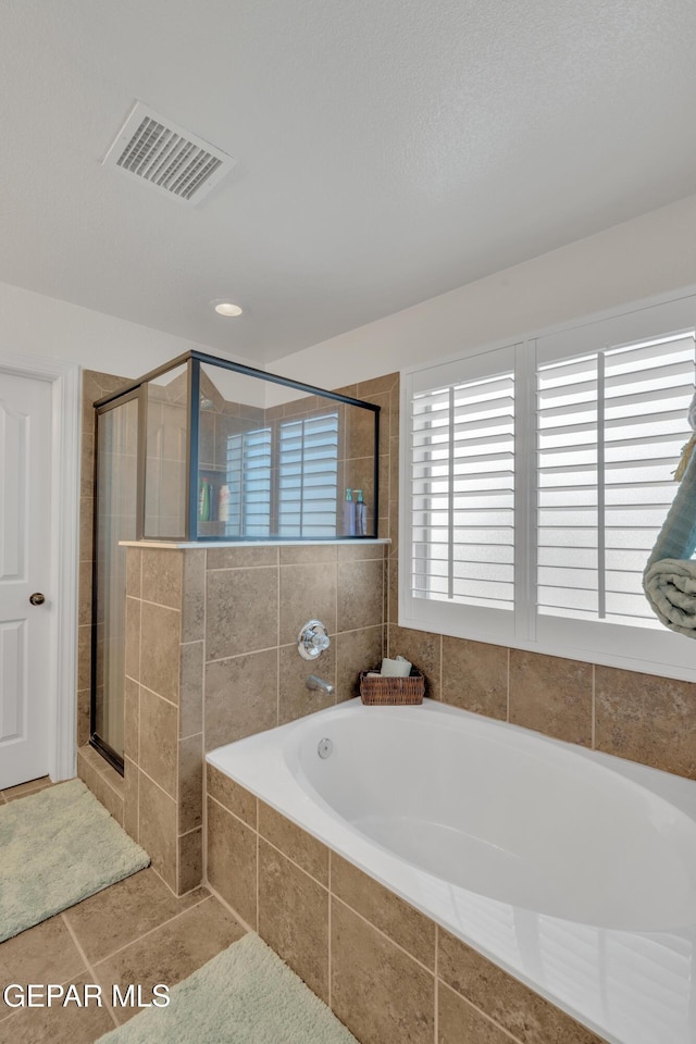 2201 Morning Mist Pl, El Paso, TX 79938 - bathroom with a bath, a stall shower, and tile patterned flooring