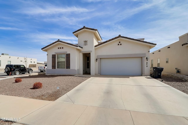 974 Airship Pl, Horizon City, TX 79928 - mediterranean / spanish-style house with a garage, concrete driveway, and stucco siding