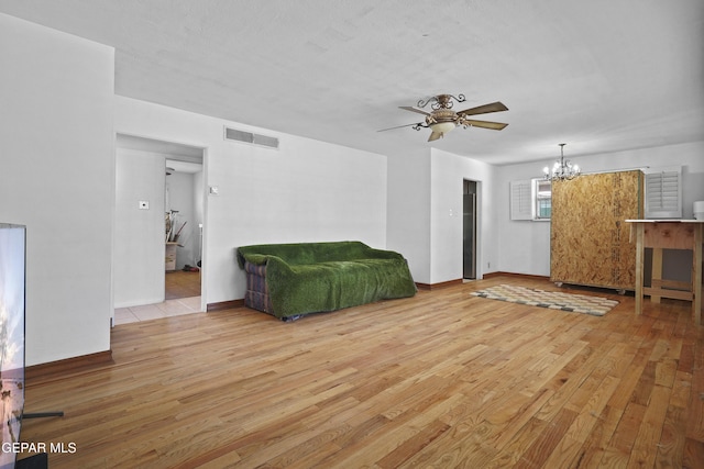 8108 Edgemere Blvd, El Paso, TX 79925 - living room with a chandelier, wood finished floors, ceiling fan, and baseboards